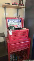Overall view of red chest showing top box, bottom cabinet and shelf above