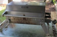 Photo of a Better Homes and Gardens stainless steel grill with a closed hood showing wear and rust spots mainly on edges