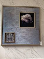 Front view of the large floral 37x37 metal framed canvas art with inset floral ornamental panel.