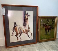 Both framed horse art pieces shown together, one larger wood framed painted canvas and one smaller gold framed watercolor print