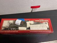 Original packaging of Bachmann Big Haulers G scale 2-4-2 steam locomotive with coal tender showing the clear display window and foam inserts protecting the model.