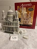 Full view of St. Paul’s Cathedral miniature with original packaging and lighting component placed behind it, showing the full set.