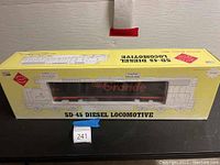 Front view of original yellow Aristo Craft Trains box showing SD-45 Diesel Locomotive text and display window