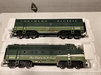 Two locomotives side by side in styrofoam insert, top unit marked 6503B, bottom unit 6503C