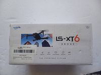 Top view of the LS-XT6 drone box highlighting the product name and brand information, showing folded drone image and product slogan 'The Everyday Flycam'
