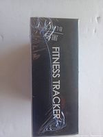 Photo of sealed black box packaging of the fitness tracker labeled 'Fitness Tracker Black'.
