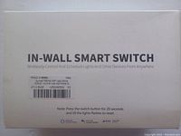 Top of the box showing product name 'IN-WALL SMART SWITCH' and use details for wireless control and reset instructions.