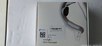 Box of intelligent neck massager showing product name on packaging.