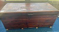 Overall view of the cedar chest showing rectangular shape and wood finish