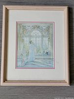 Full view of framed vintage print Bright Eyes by Trisha Romance showing mother holding baby in nursery with crib and toys.
