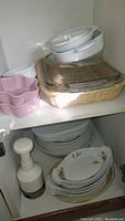 Glass and ceramic bakeware, bowls, pink flower-shaped bowls, Pyrex Butterprint dishes