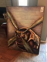 Full view of oversized aviation-themed wall art showing metal airplane propeller mounted on wooden background with visible scratches on frame.