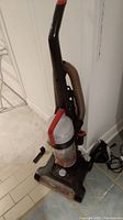 Front angled view of Power Force Turbo upright vacuum cleaner showing handle, hose, and base