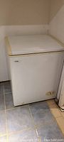 Danby Millennuum white chest freezer, front view showing overall shape and control knob.