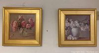 Both framed paintings side by side on wall