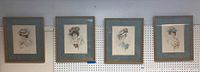 Overview of the four Victorian women portraits in gold frames with blue mats hung side by side.