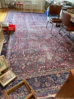 Full view of the entire rug laid out on hardwood floor beneath furniture
