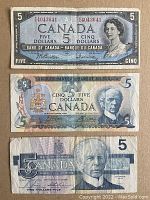 Front sides of the 1954, 1979, and 1986 Canadian five-dollar banknotes showing portraits and bank details.
