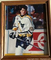 Framed signed photo of Jaromir Jagr in hockey uniform on ice
