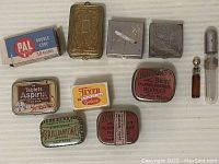 Overview of all miniature vintage containers showing metal, paper, and glass materials.