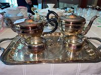 Photo showing silver plate tea and coffee set on matching tray