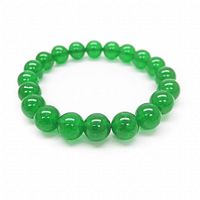Green jade beaded bracelet shown lying flat on white background, displaying the round polished beads and overall bracelet shape.