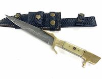 Full view of the hunting knife laying next to the black stitched leather sheath with brass button snaps.