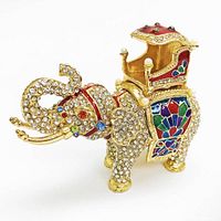 Front and side view of a gold-tone Faberge inspired elephant figurine decorated with clear crystals and multicolored enamel accents