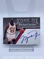 Front view of Michael Jordan basketball card with facsimile autograph and player image in Chicago Bulls jersey #23.