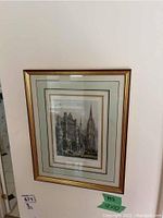 Framed print of Cathedral de Chartres wall hung with green tag noting size 12x10 inches