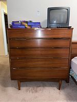 Front elevation of five-drawer walnut veneer chest