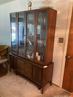 Front view of two-piece china cabinet assembled top and bottom
