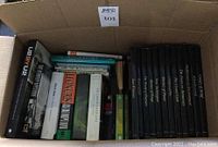 Overview photo of the assorted box of books showing titles and varied bindings