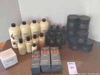 Overall view of Philosophy cleansers and moisturizer, Bella Spirit styling and body treatments, and Aquis boxed hair hydration products