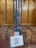 Front view of the four Twilight Saga Blu-ray movie cases stacked vertically with visible spine labels showing titles Twilight, New Moon, Eclipse, and Breaking Dawn Part 1.