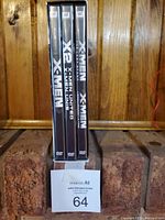 Four X-Men DVDs shown in standard cases.