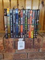 Spine view of 18 DVDs including Pandorum, The Abyss, Alien, The Fly, and more