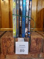 Photo showing spines of 6 movies tied together, including Suicide Squad, Snow White & The Huntsman, The Mummy, Robin Hood, Insurgent, Divergence.