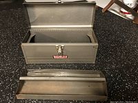 Open grey metal Craftsman toolbox with top drawer removed, showing interior empty compartment and drawer.