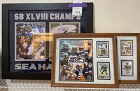 Three framed Seahawks items on wire shelf against wall
