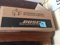 Original packaging box with BOSE Acoustimass 5 Series II labeling and speaker system branding