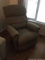 Front-left angle showing chair upright with rolled arms and padded backrest