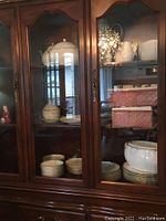 China cabinet overview showing dinnerware and serving pieces