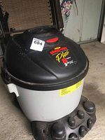 Front and top view of Shop-Vac Plus wet/dry vacuum showing brand label and capacity 8 gallons and 3.0 peak HP.