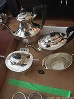 Group view of coffee pot, teapot, sugar bowl and creamer