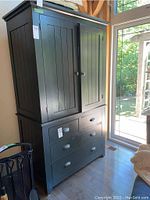 Front view showing painted pine cabinet with two upper doors and four drawers