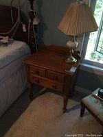 Front view of nightstand with lamp showing overall condition