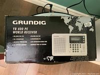 Photos of Grundig YB 400 PE World Receiver box showing model and features.