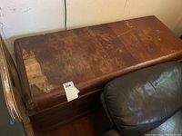 Top view of the cedar chest showing worn and damaged surface.