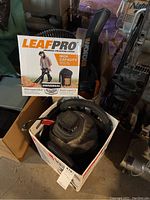 Shop Vac, Leaf Pro system, and Worx leaf blower visible together with Leaf Pro box and shop vac in cardboard box